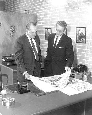 Publix founder George Jenkins (left) consults with Bill Schroter, who coined the companyâ€™s enduring corporate slogan, â€œWhere Shopping is a Pleasure.â€