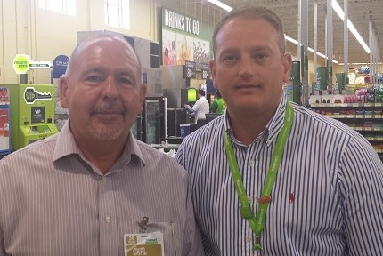 Walmart regional general manager Nick Berkeley (right, pictured with market manager Carl Simpson), says Walmart has worked hard to boost hot food offerings in Neighborhood Market stores.