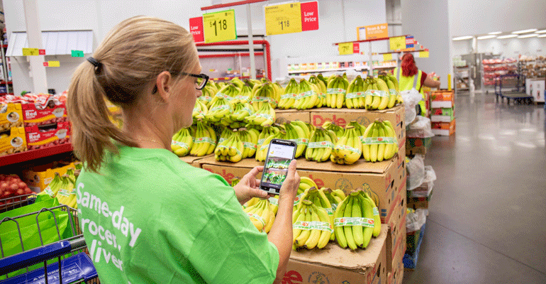Sams_Club_Instacart_shopper_with_smartphone.png