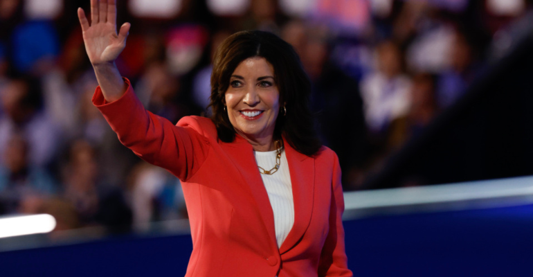 New York Gov. Kathy Hochul waves to the crowd.png