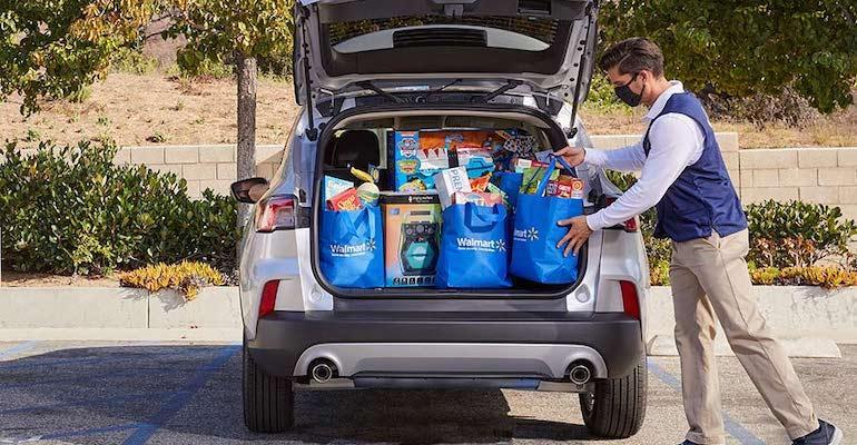 Walmart_grocery_pickup_associate-loading_car.jpg