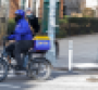 A Getir instant food delivery employee rides a bike near Washington Square Park.png