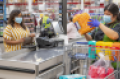 Walmart_shopper_at_checkout-COVID_copy_1.png